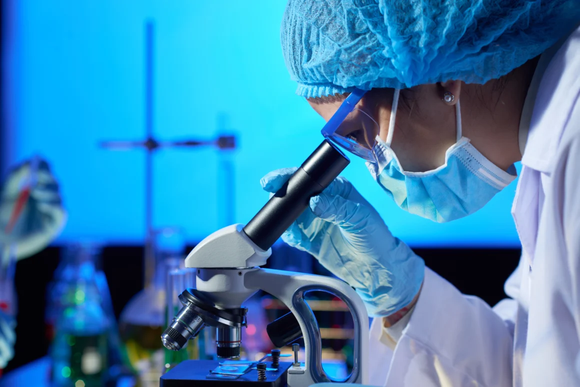 examining-sample-with-microscope Clinical Research and Trials
